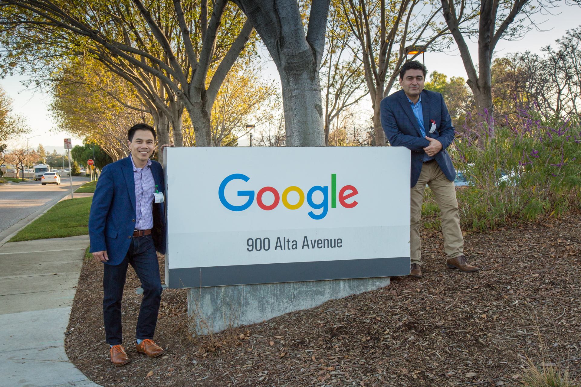 Image of eff Cadavez and Christian Ramirez posing at the entrance of the Google Building in Mountain View, California.