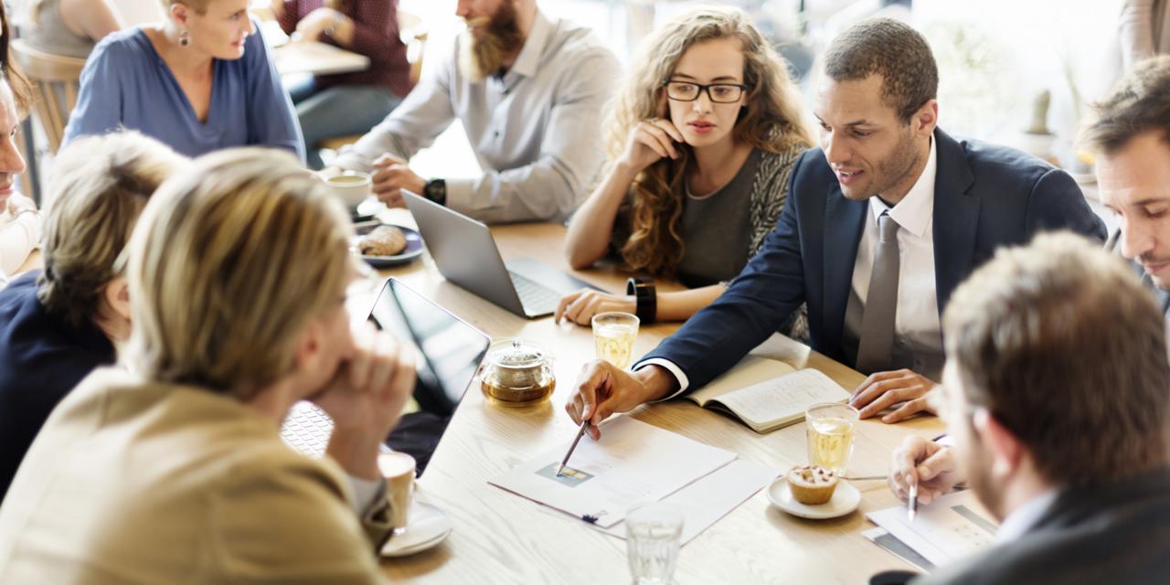 Group of People Working Together at a Table