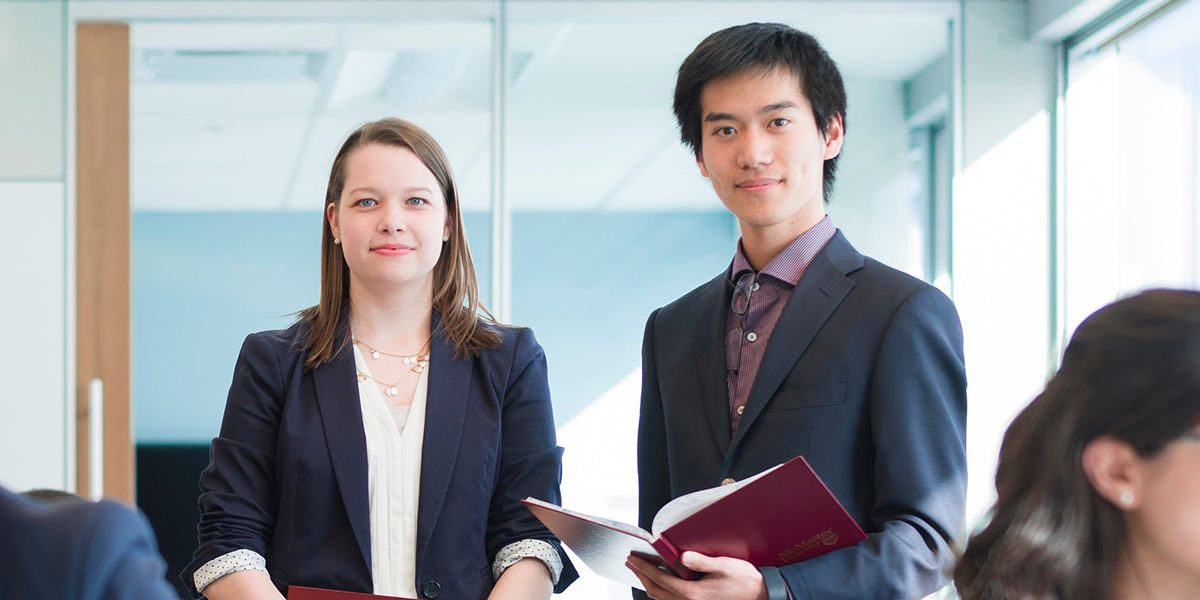 Two Students in Business Clothes