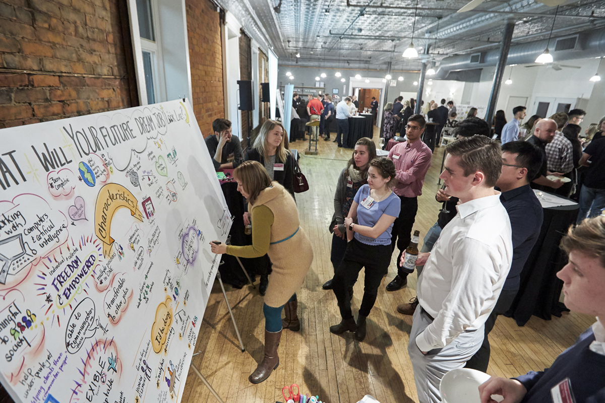 People contributing to idea board at BCom Conversation Launch