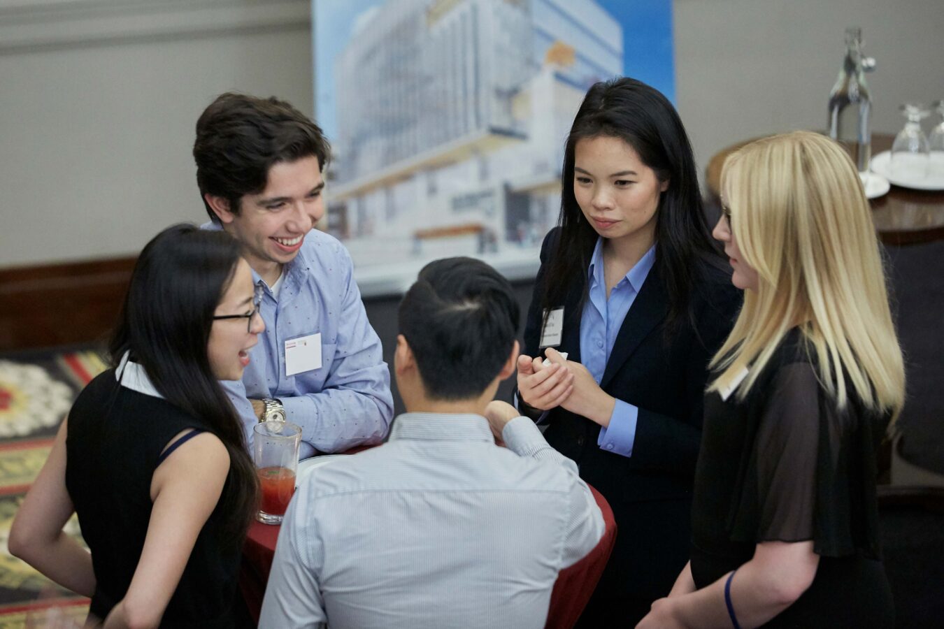 Students talking in circle with professors