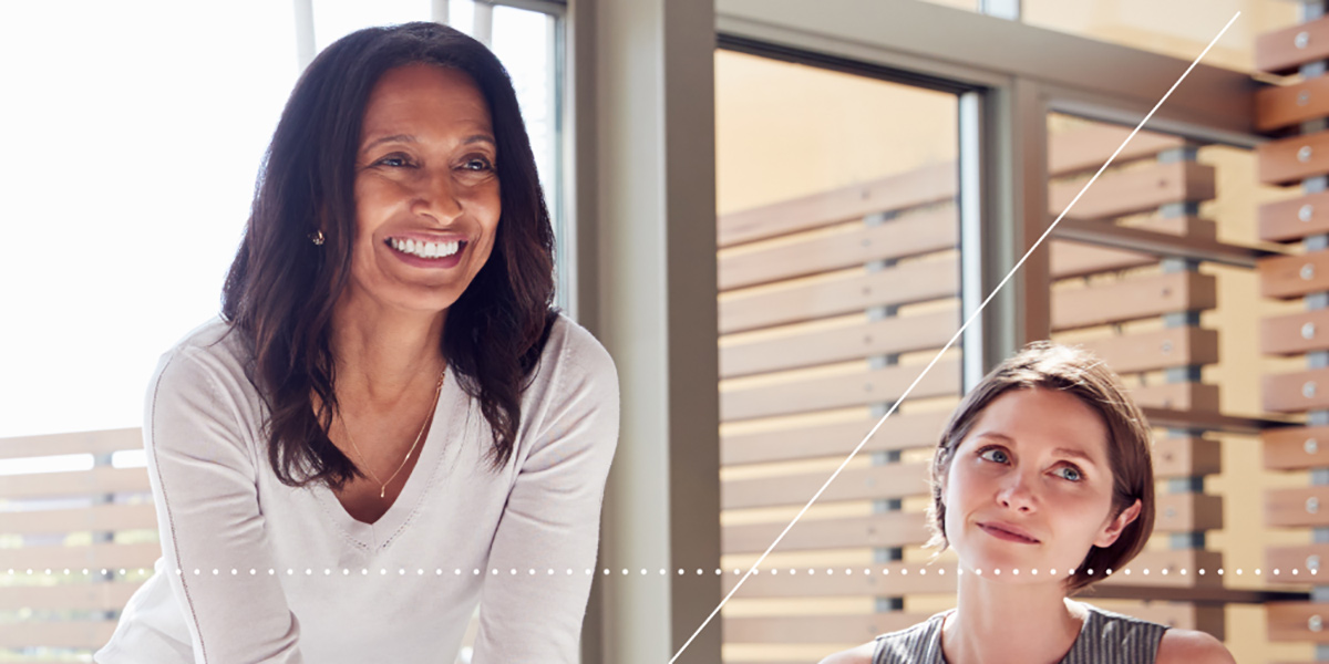 Woman smiling and teaching in modern learning environment