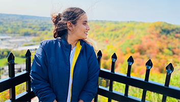 Megha looking into the distance in the fall from escarpment