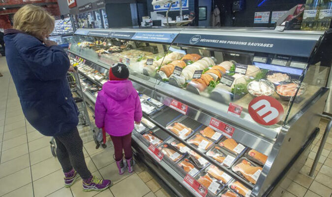 A customer looks at the seafood counter at a Metro store in Ste-Therese, Que. (The Canadian Press/Ryan Remiorz) middle class retail