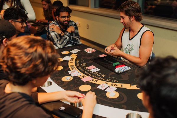 Students playing blackjack at a casino table