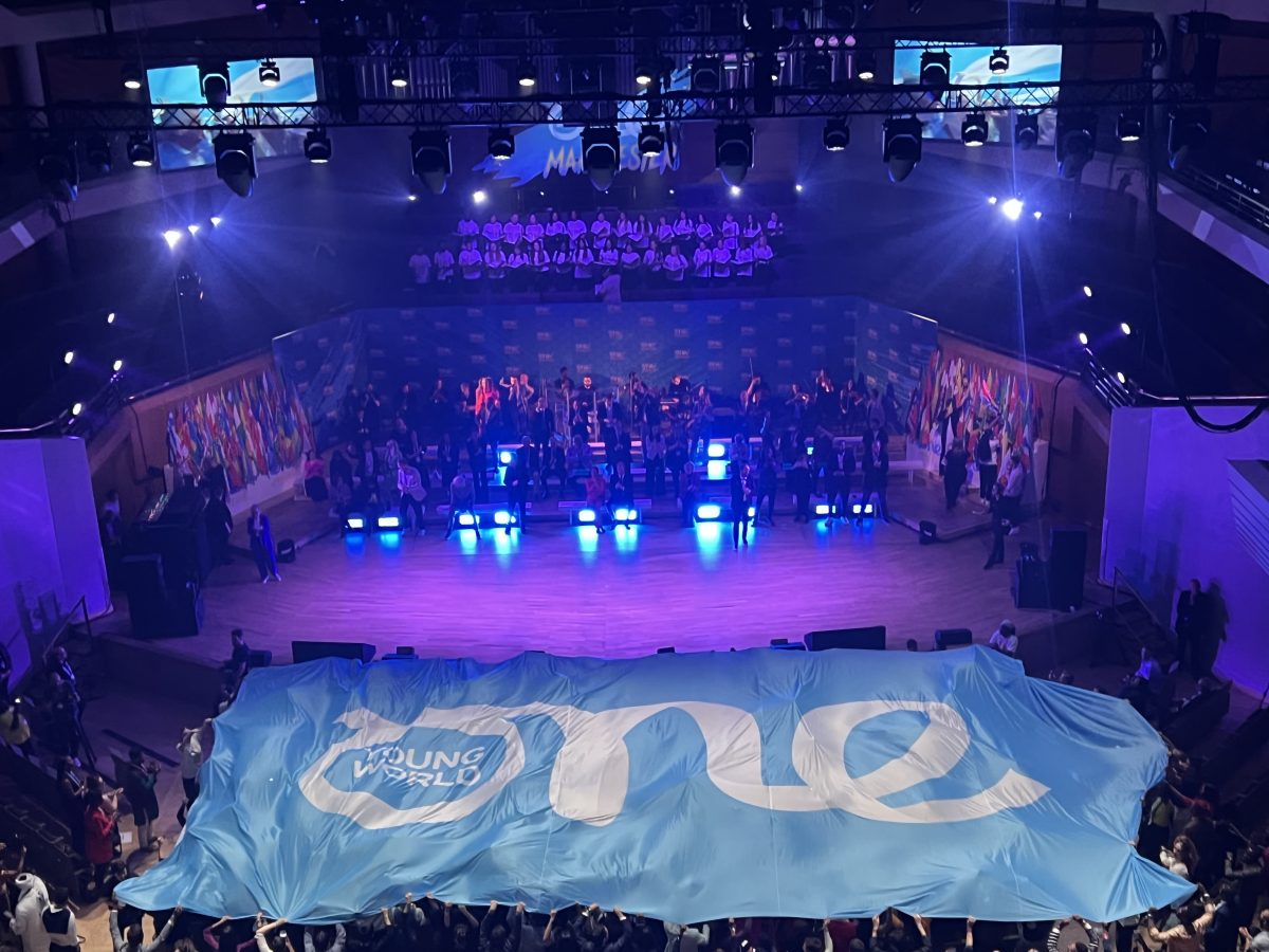 Flag spreads over crowed at opening ceremony of the One Young World Summit