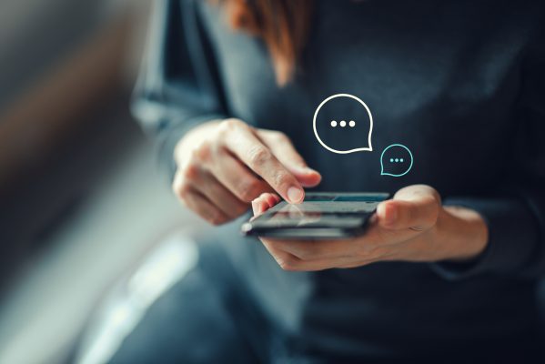 woman scrolling through social media on smart phone