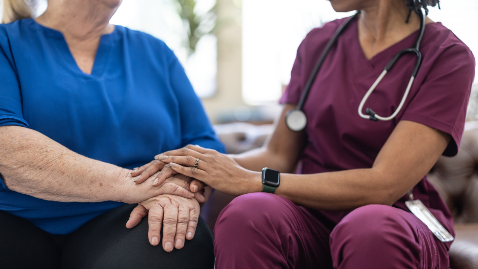 Nurse visiting a senior in a homecare setting.