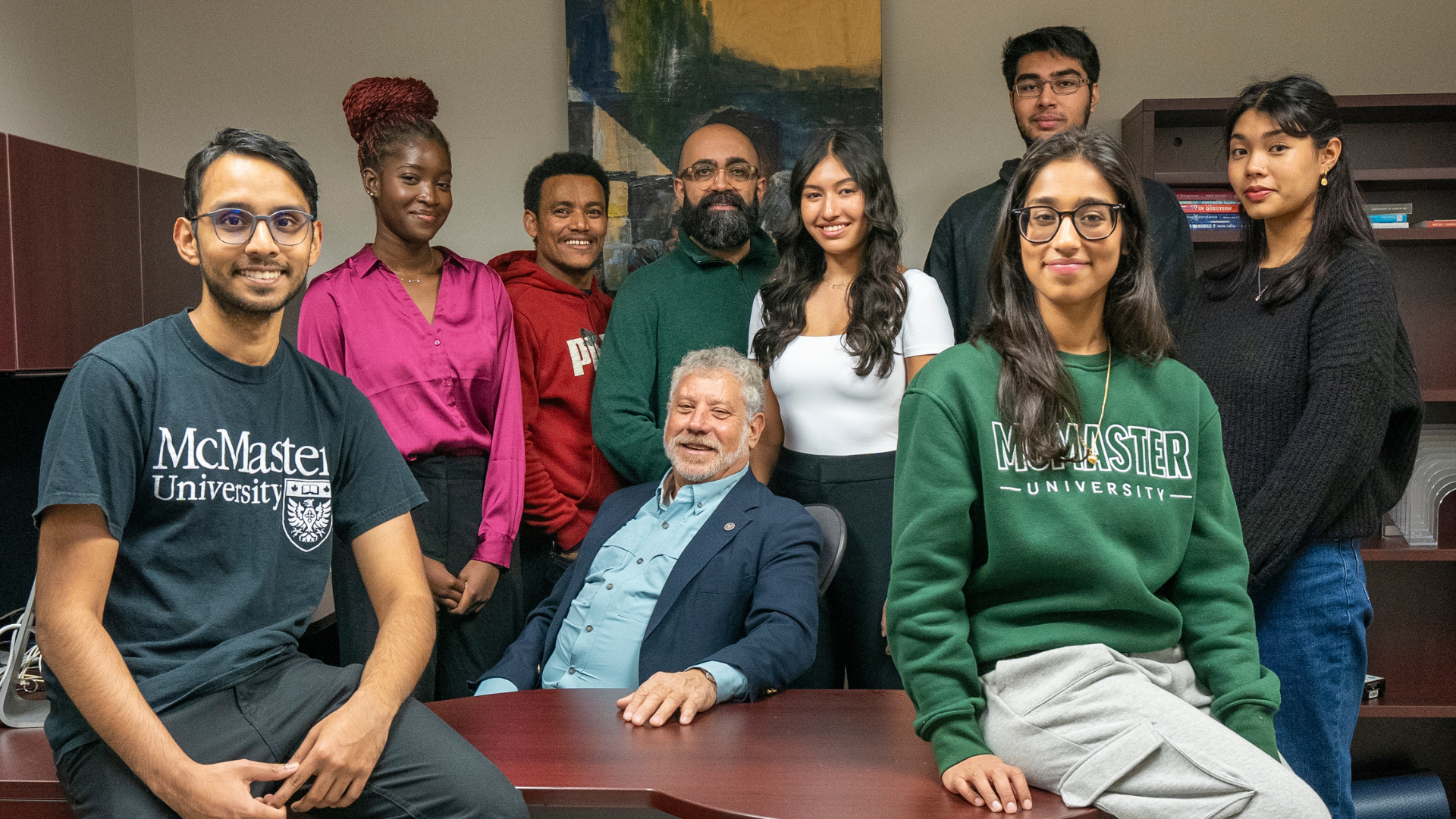 Benson Honig in his office with undergraduate and graduate research students