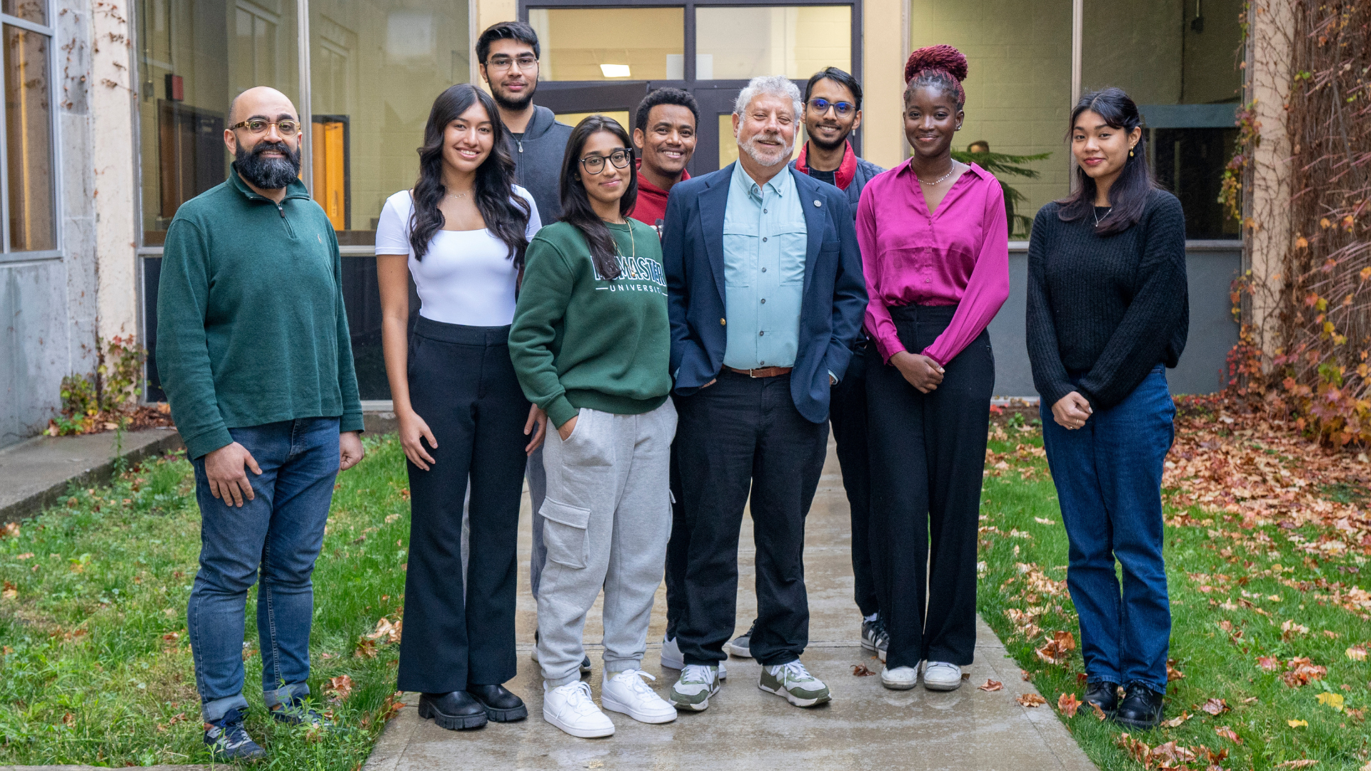 Benson Honig outside with undergraduate and graduate research students