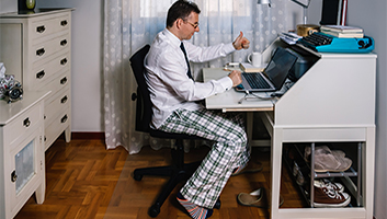 Man working from home with no dress pants